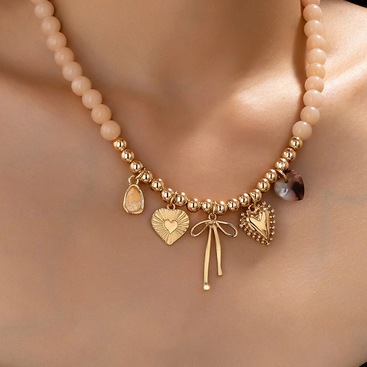 Beige Beaded Bow Heart Charm Necklace